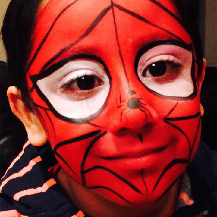 Face painted like Spiderman